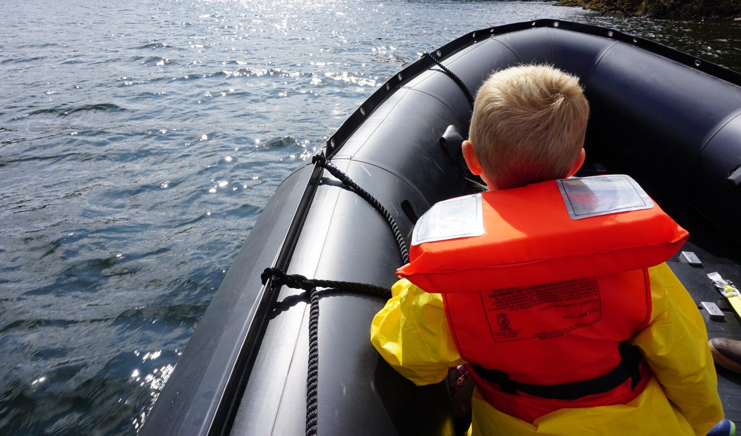 Child sitting in Zodiac